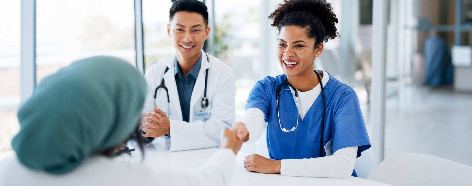 Healthcare professionals meeting with a patient